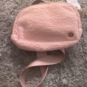 Fluffy pink and gold lululemon belt bag